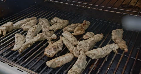 Juicy Chicken stripes on the grill checking temperature Stock Footage 137927145