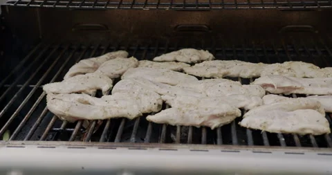 Juicy chicken strips on the grill Stock Footage 137927111