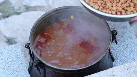 Juicy chickpea dish being cooked 2 Stock Footage 294063923