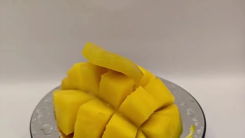 Juicy cut yellow mango fruit yummy fruit composition Stock Footage 325127346