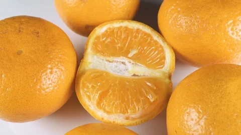 Juicy fresh orange on a light background close up Video stock 106360721
