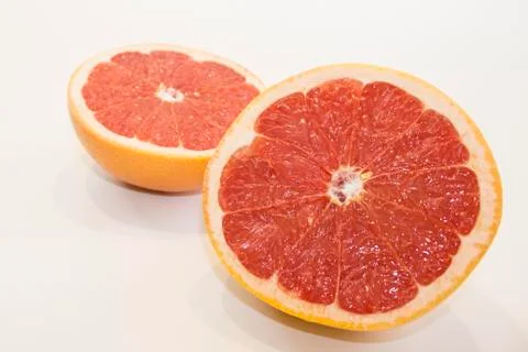 Juicy grapefruit close up view on white background Stock Photos