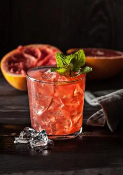 Juicy grapefruit drink on dark table Stock Photos