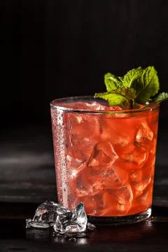 Juicy grapefruit drink on dark table Stock Photos
