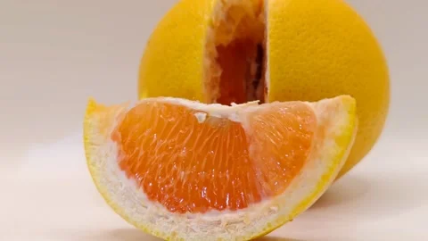 Juicy grapefruit slice slow motion Stock Footage 331746504