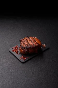 Juicy grilled beef steak seasoned with salt, spices, and herbs. Beef steak Stock Photos