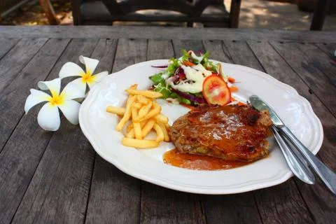 Juicy grilled pork chop Stock Photos