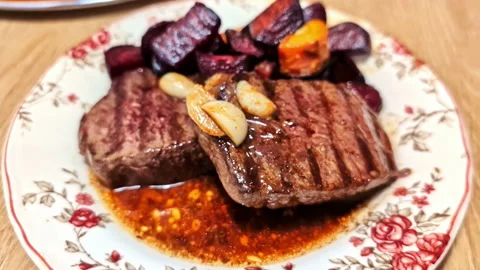 Juicy Grilled Steak with Roasted Vegetables on Decorative Plate in Jelgava Stock Footage 314058326