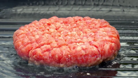 Juicy Ground Beef Burger Sizzling On Griddle Surface Video stock 325840243