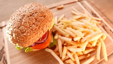 Juicy hamburger with fried potatoes Stock Footage 74170492