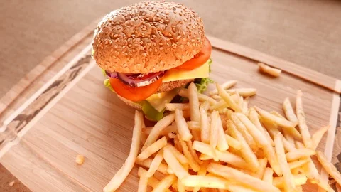 Juicy hamburger with fried potatoes Stock Footage 74170565