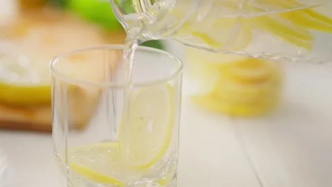 Juicy, housewife absorbed in the process of preparing mojito lemonade drink Stock Footage 323709168