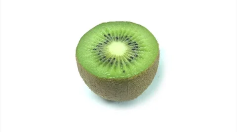 Juicy kiwi rotating on a white background Stock Footage 8509611