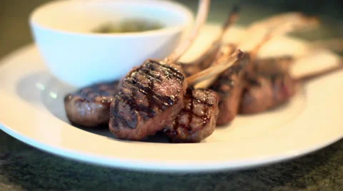 Juicy Lamb Cutlets Served With A Basil Pesto Dip. Stock Footage 37188257
