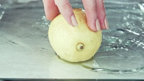 Juicy lemon. Lemon in water splashes. Stock Footage 80239041