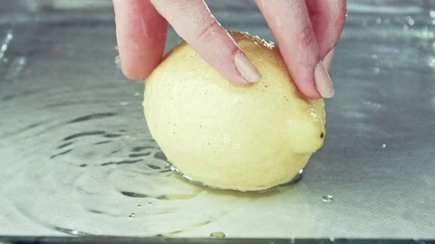 Juicy lemon. Lemon in water splashes. Stock Footage 80239240