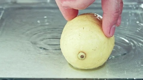 Juicy lemon. Lemon in water splashes. Stock Footage 80239575