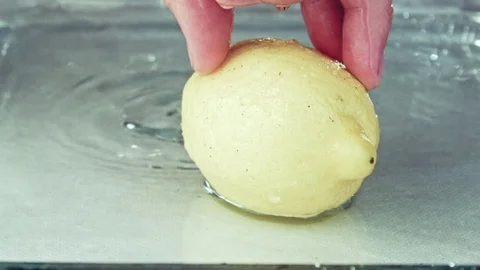 Juicy lemon. Lemon in water splashes. Stock Footage 80239728