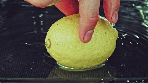Juicy lemon. Lemon in water splashes. Stock Footage 80239869