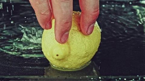 Juicy lemon. Lemon in water splashes. Stock Footage 80240025