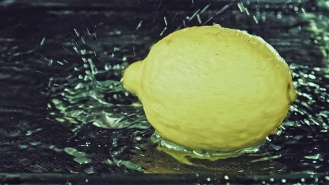 Juicy lemon. Lemon in water splashes. Stock Footage 80240117