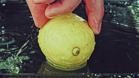 Juicy lemon. Lemon in water splashes. Stock Footage 80240278