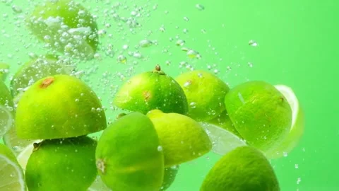 Juicy Lime Halves Submerged. Bubble Burst In Slow Motion. Stock Footage 309411540