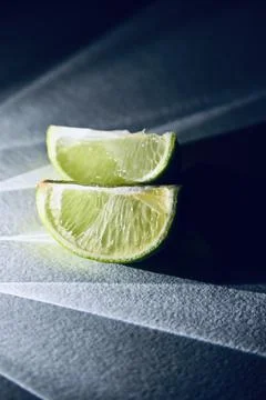 Juicy Lime Wedges with Dramatic Direct Light and Rays Shadow Effect Фото