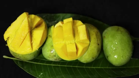 Juicy Malda variety of mango fruit display featuring sliced mango cubes and Stock Footage 337455453