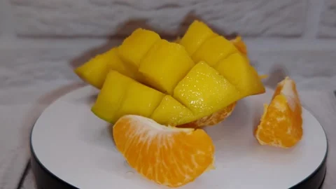 Juicy mango and tangerine Stock-Footage 329936282