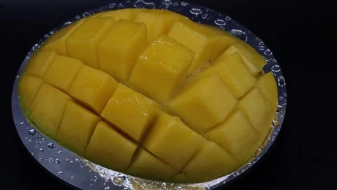 Juicy mango with drops of water Stock Footage 329645702