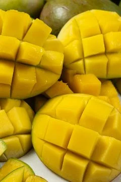 Juicy mango halves with cube cut pattern. 写真素材