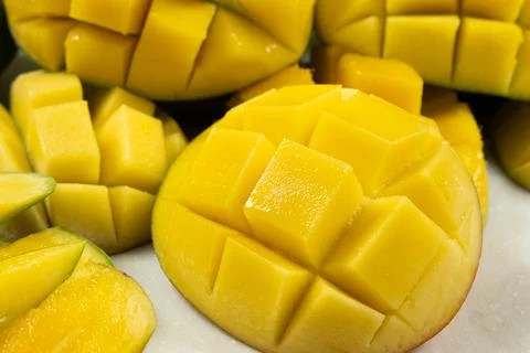 Juicy mango halves with cube cut pattern. 写真素材