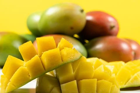 Juicy mango halves with cube cut pattern. Stock Photos