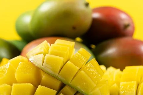 Juicy mango halves with cube cut pattern. Stock Photos