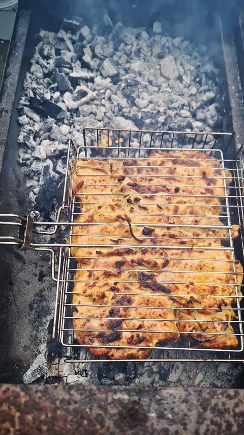 Juicy Marinated Chicken Meat Grilling on Charcoal Bbq Wire Rack Stock Footage 339002178