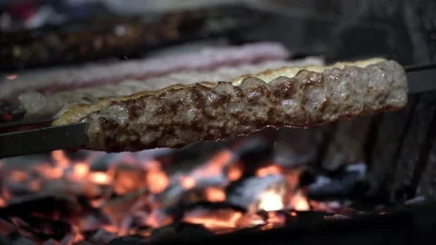 Juicy meat is cooked on the grill Stock Footage 145653070
