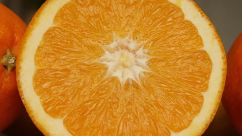 Juicy orange sliced in half. Close up. Stock Footage 260122496