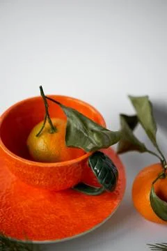 Juicy orange tea pair on the background of fir branches.A feeling of freshness Stock Photos