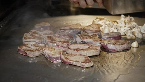 Juicy pieces of beef roasting on a hot grill Stock Footage 304955697