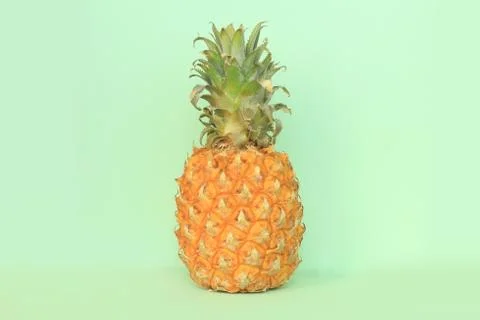 Juicy pineapple on a light green background Stock Photos