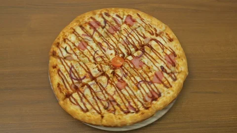 Juicy pizza rotates in a circle on a round plate. Stock Footage 125704042