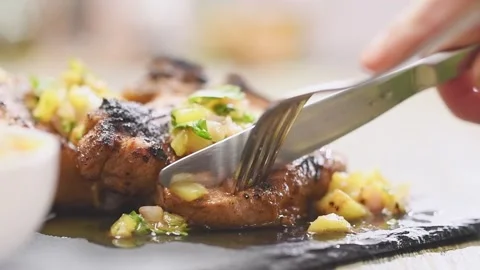 Juicy pork chops with pineapple salsa. Stock Footage 159401393