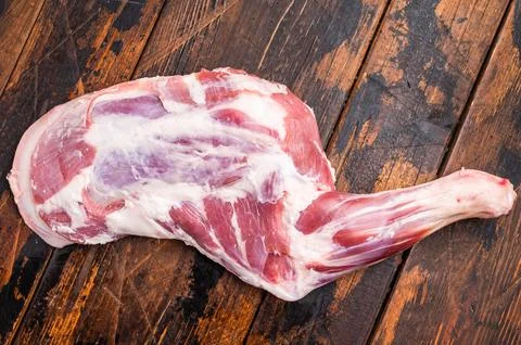 Juicy raw mutton lamb shoulder cut, showcasing its vibrant color and textur.. Stock Photos