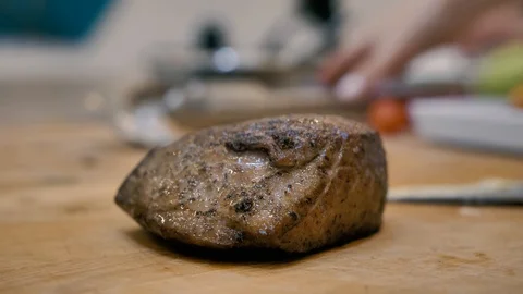 Juicy ready meat steak overturned with tongs Video stock 125922247