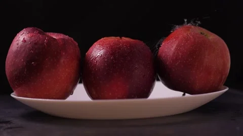 Juicy red apples close up.Fresh fruits and berries splashing Stock Footage 186986925