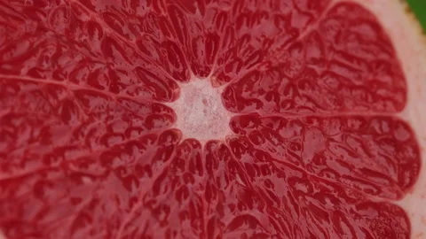 Juicy Red grapefruit rotate on green background Stock-Footage 165193473