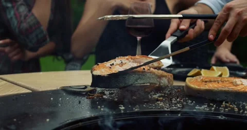Juicy red meat placed on the grill steak on the flaming grill season Stock Footage 336575938