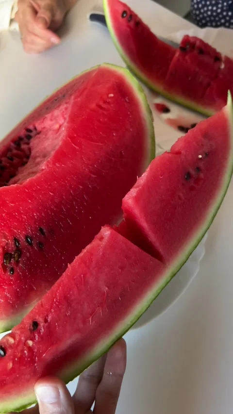 Juicy, ripe, red watermelon on the table Stock Footage 237761327