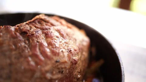 Juicy roast beef with vegetables in a pan stands on the table Stock Footage 280295372